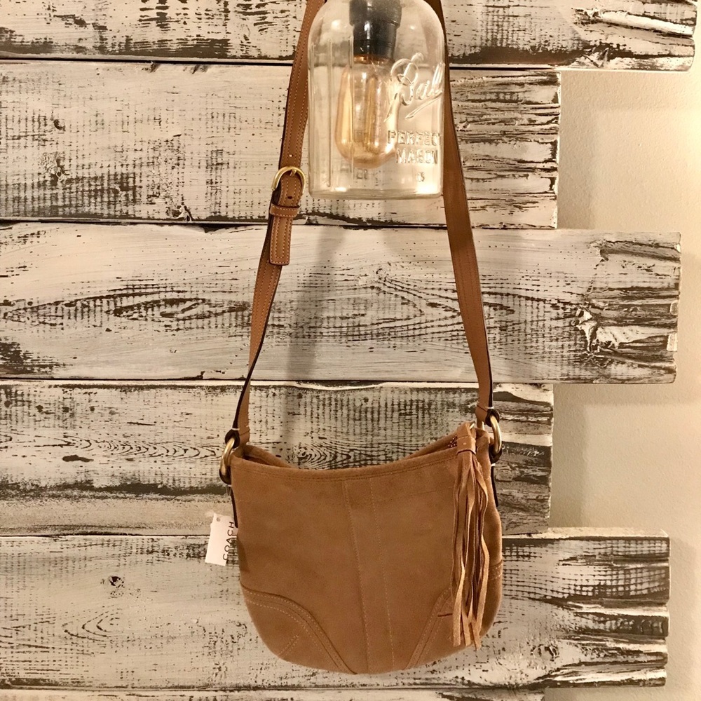 Suede Coach Crossbody handbag with tassel.